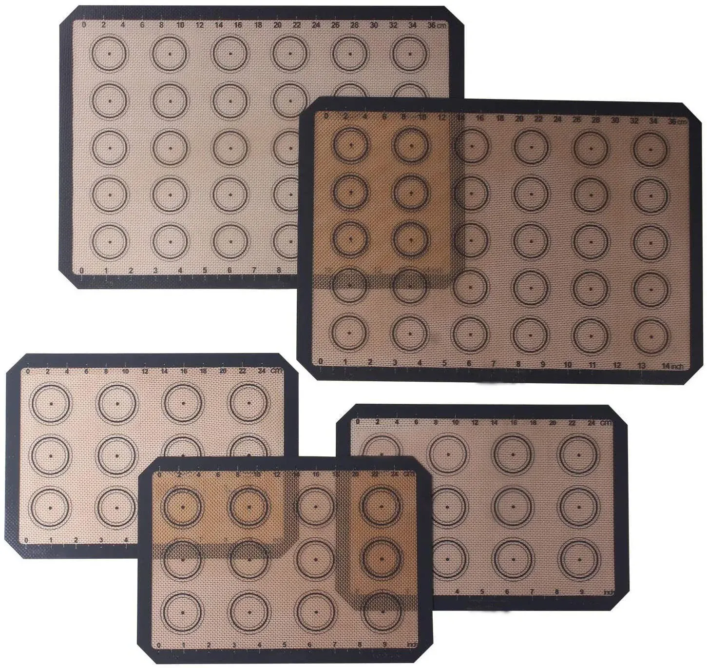 Black silicone macaron baking mats with printed circles and measurement marks