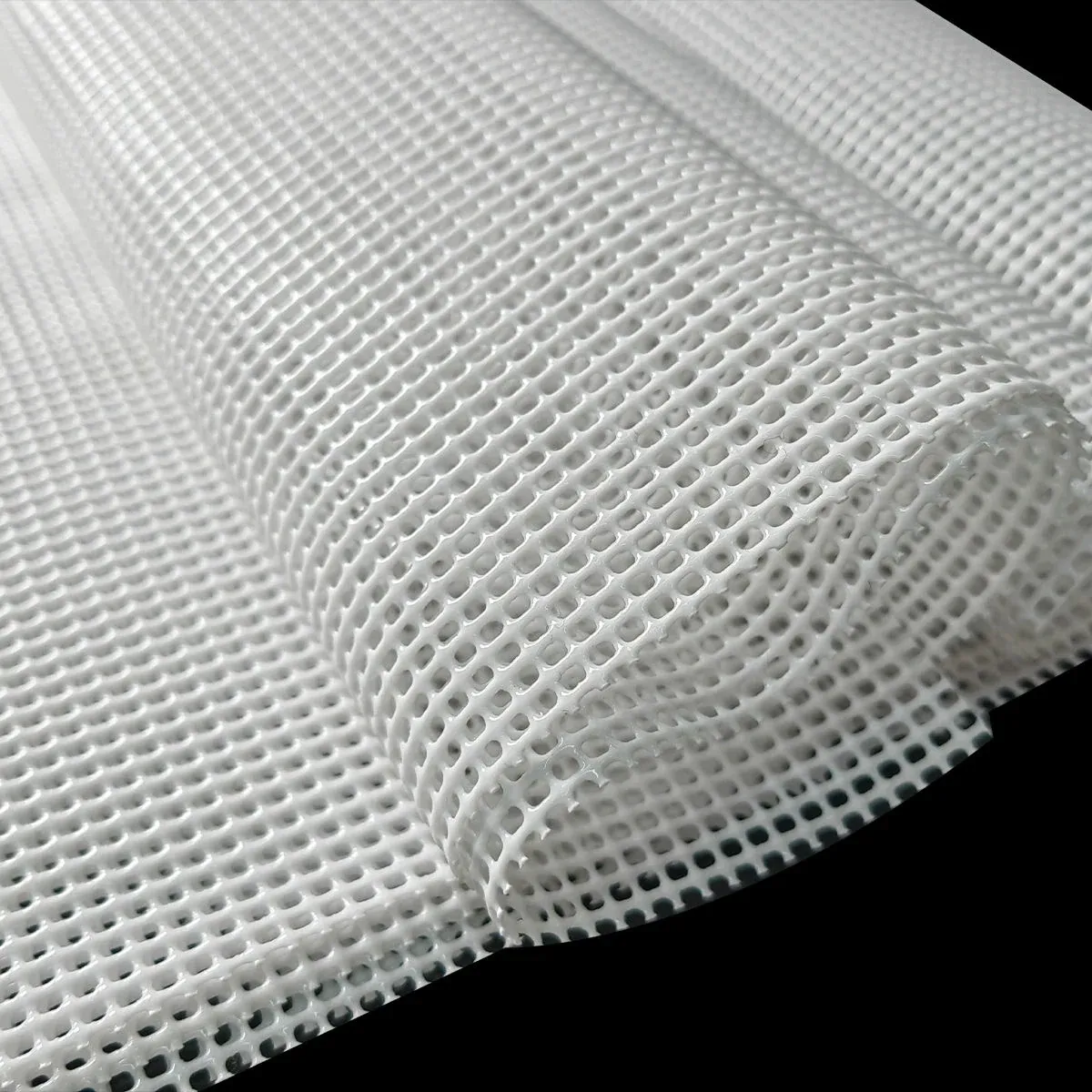 Close-up of white silicone steamer mat perforated surface