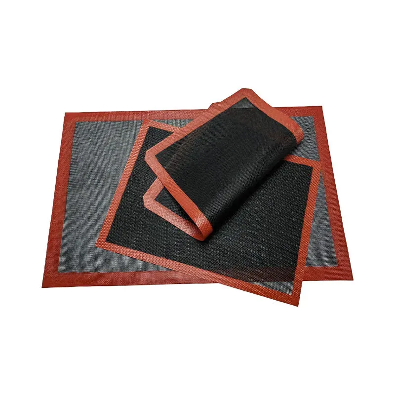 Black silicone mesh baking mat with red border on clean background