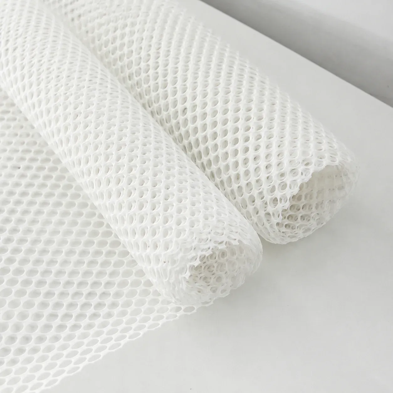 Rolled white silicone mesh material