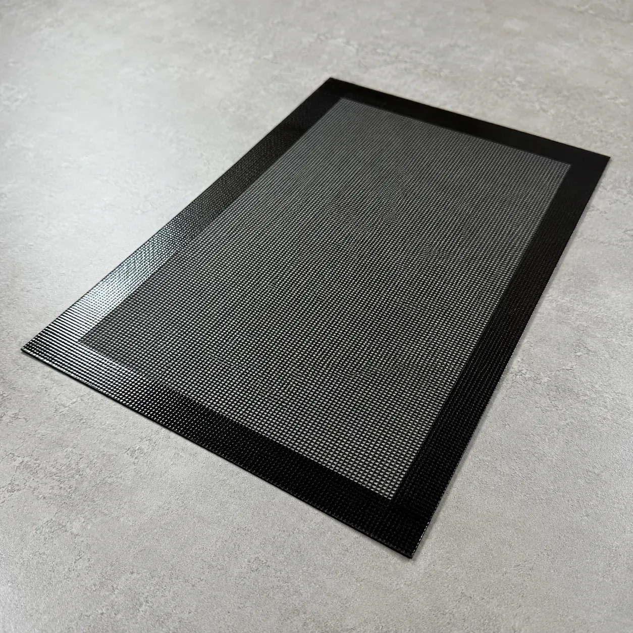 Black silicone mesh mat for a convection oven tray