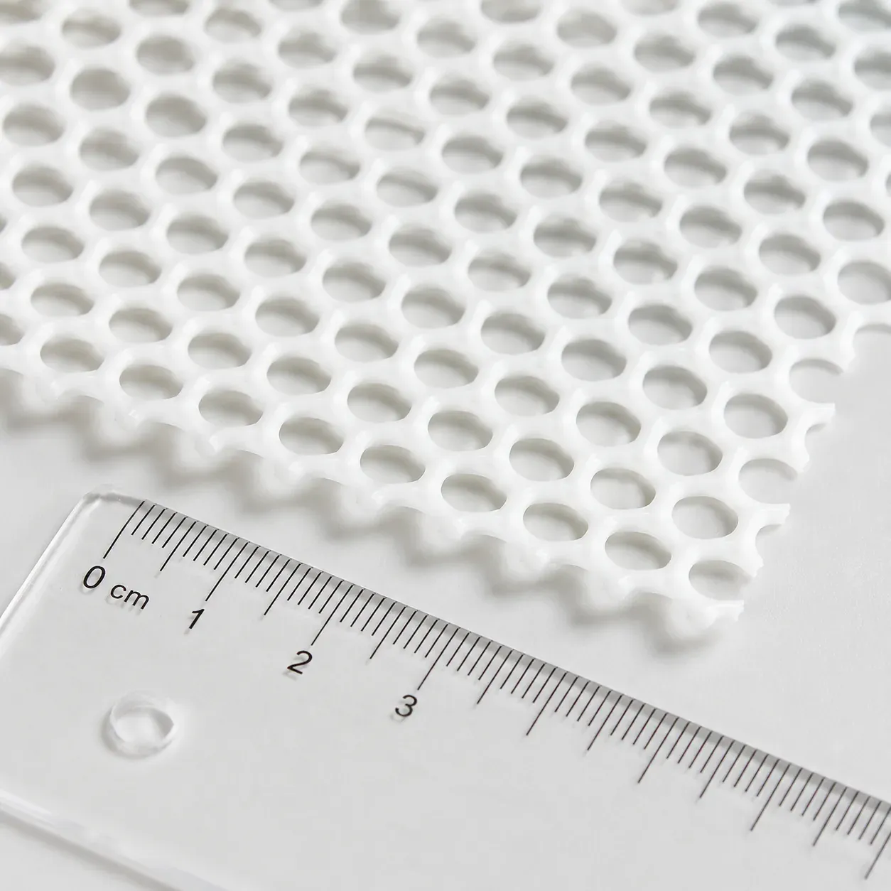 White silicone mesh with a millimeter scale
